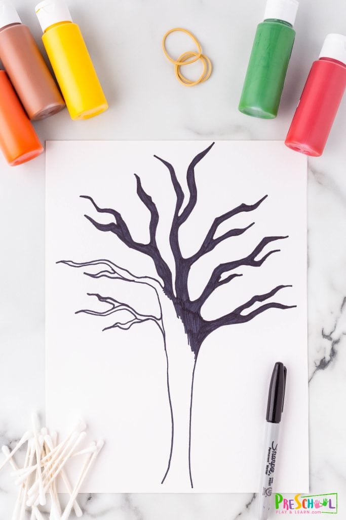 Paint or draw with a sharpie the trunk and branches on your paper to fill the space. 

Hint: This part can be done ahead if you want to simplify the project for your classroom.