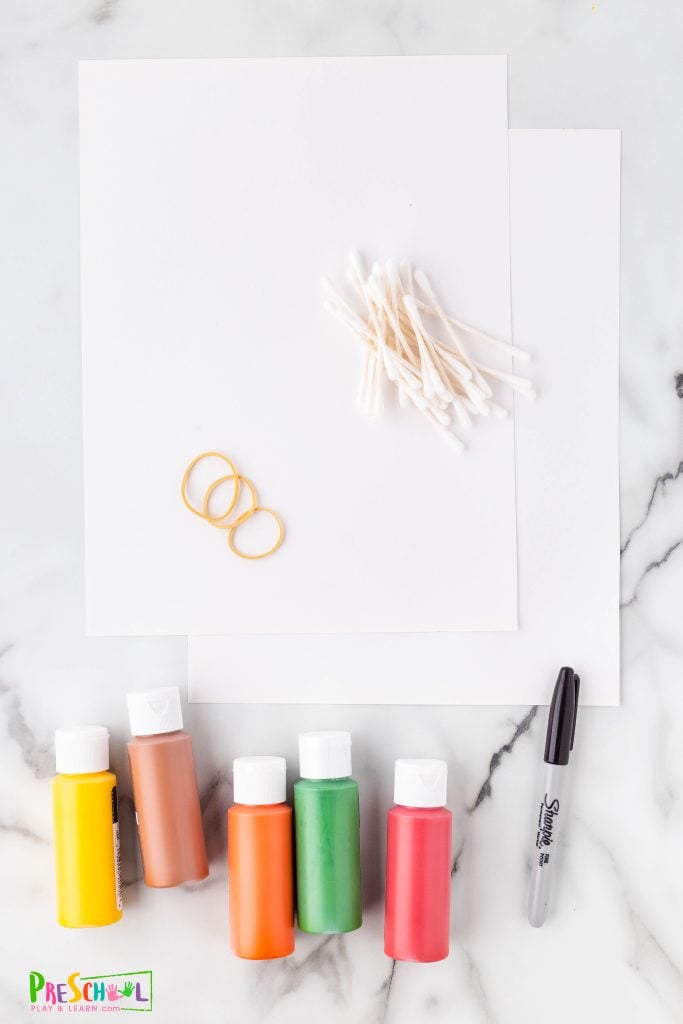 All you need to make your own q-tip painting masterpiece for fall are a few simple materials:

white cardstock
acrylic paint in fall colors
Q-Tips
rubber bands
paint brush
sharpie or black paint