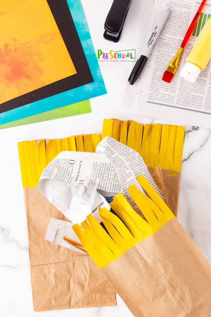 Fill your scarecrow's bag with newspaper to add stability and shape! It’s a great way to ensure your scarecrow stands tall and looks fantastic. 